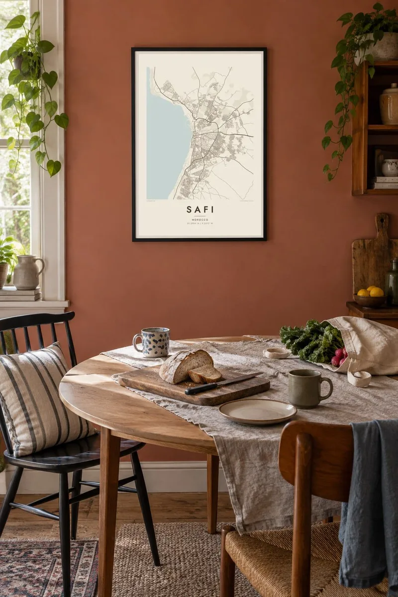 Safi map poster in a black frame, dining terracotta interior
